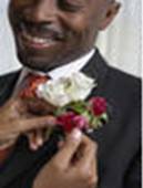 stock photo : Woman pinning flowers onto man's lapel